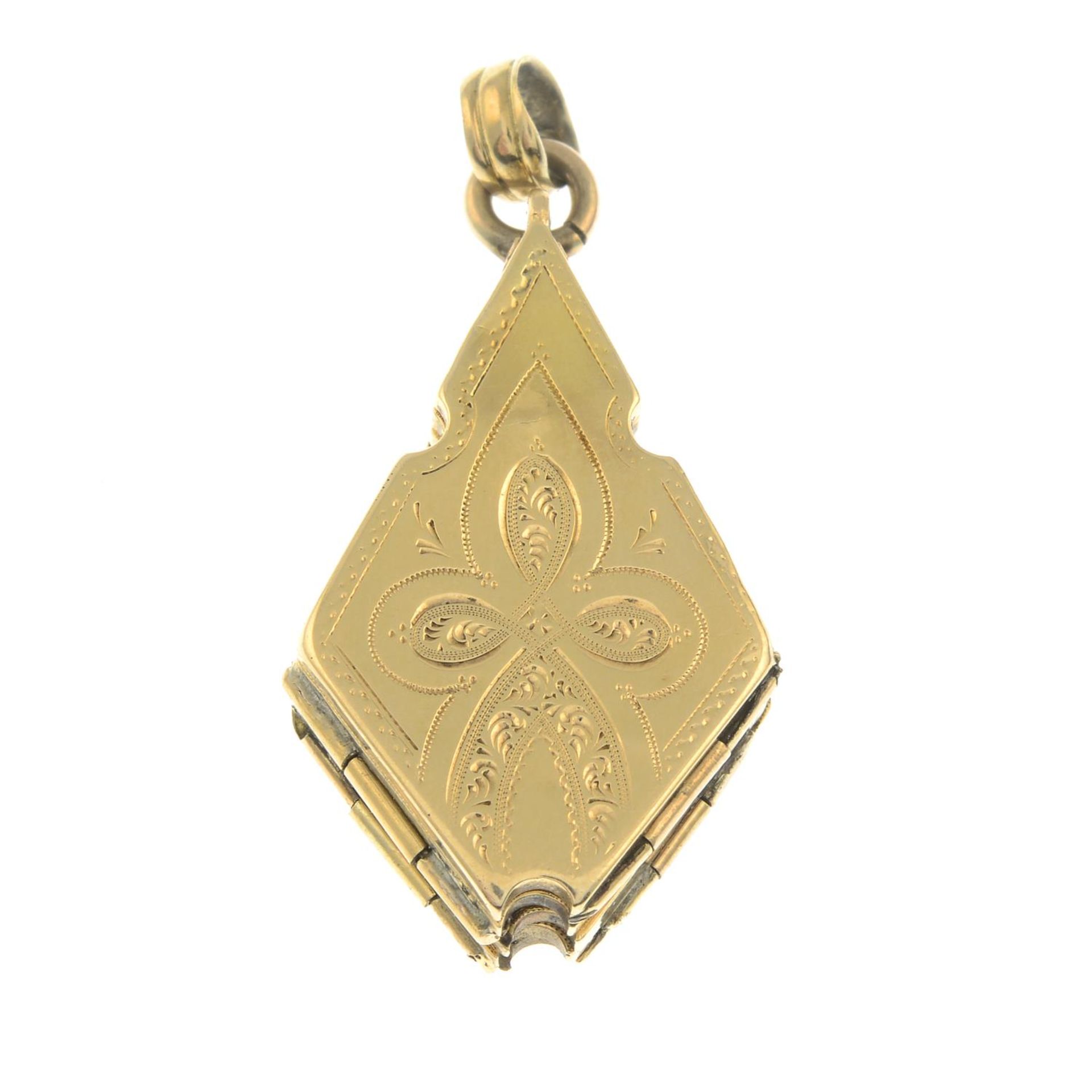 An early 20th century locket, unfurling to reveal star, with oval-shape vacant panels.Length 4cms.