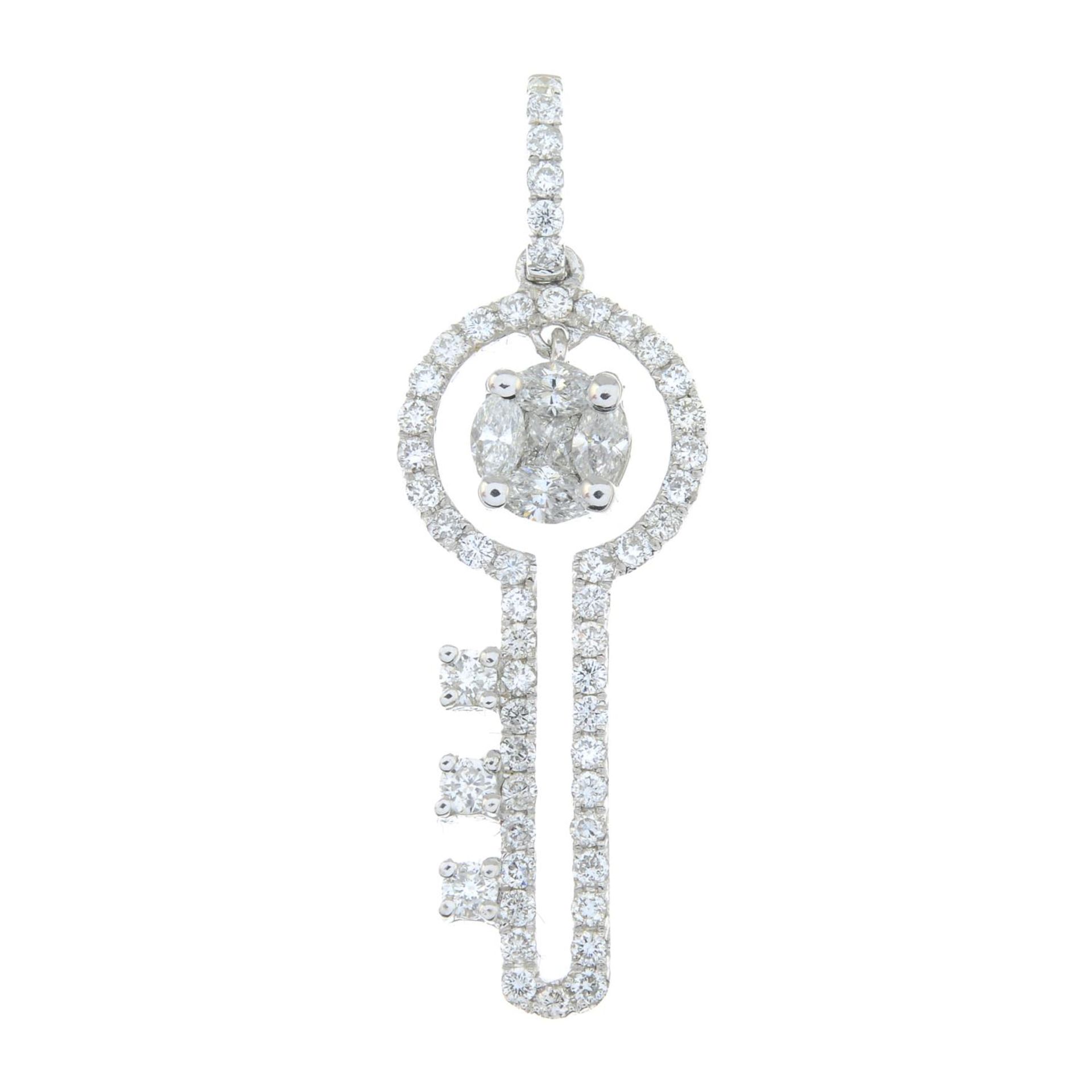 A diamond key pendant.Estimated total diamond weight 0.45ct.