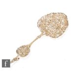 A Victorian hallmarked silver gilt pierced ornate spoon decorated with cherubs within foliate