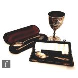 A hallmarked silver Victorian small goblet with embossed and engraved floral decoration, London