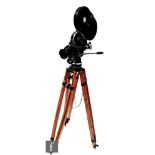 A vintage Arriflex 16mm movie camera with P.Angenieux lens on adjustable wooden tripod with two