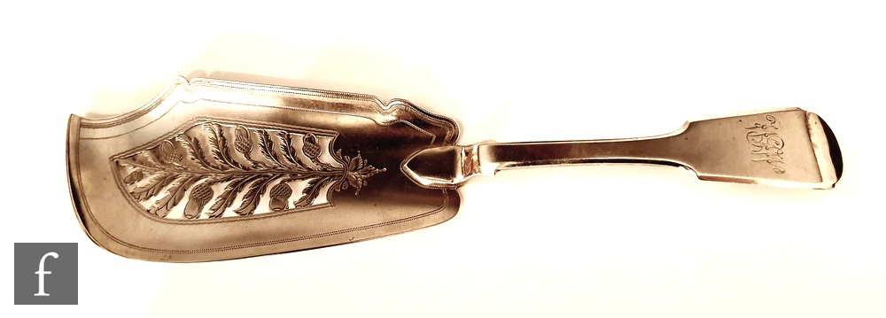 A William IV hallmarked silver fiddle pattern fish slice with pierced acorn and oak leaf