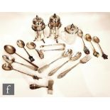 A small parcel lot of assorted silver items to include two pepper, souvenir spoons and other