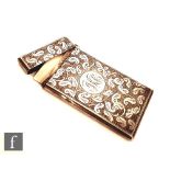 A Victorian hallmarked silver rectangular card case with foliate engraved decoration to whole,