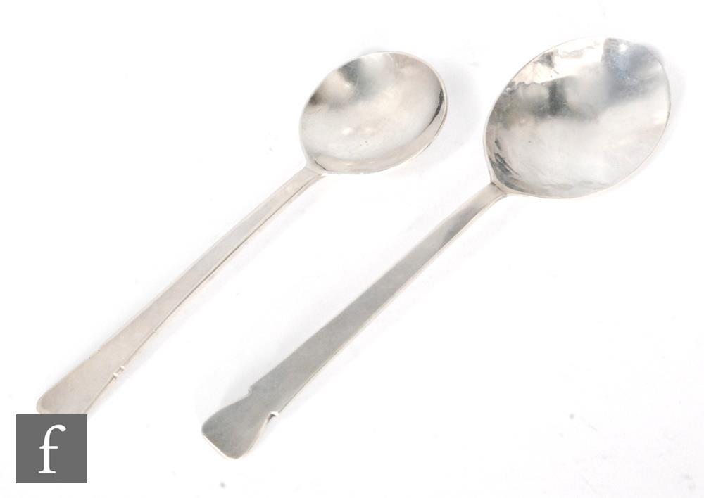 Two hallmarked silver Arts & Crafts style rat tailed planished spoons, length 16.5cm and 14cm,