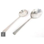 Two hallmarked silver Arts & Crafts style rat tailed planished spoons, length 16.5cm and 14cm,