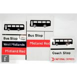 Two Midland Red Bus Stop signs with vinyl stickers and a National Express Coach Stop sign, largest