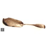 A George IV hallmarked silver fiddle pattern fish slice with pierced fish decoration to blade,