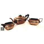 A hallmarked silver boat shaped bachelor's three piece tea set of plain form, total weight 29.5oz,