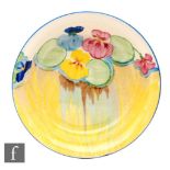 Clarice Cliff - Delecia Pansies - A circular shallow bowl circa 1934, hand painted with a band of