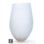 Unknown - A large contemporary studio glass vase of compressed ovoid form raised to a small base,