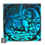 Maw & Co - A 6in dust pressed tile decorated with a seated ram, the whole glazed in turquoise,