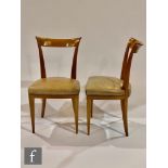 Attributed to Andre Arbus ? A pair of French 1950s satinwood chairs with scroll backs and tapering