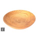 Mike Scott (Chai) - A later 20th Century elm wood turned bowl of shallow circular form, the exterior
