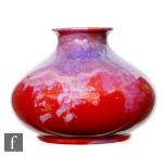 Royal Doulton - An early 20th Century Flambe vase of compressed form decorated with a tonal purple