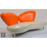 Poltromec - A contemporaryItalian orange and white leather sofa of abstract design, raised to