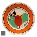 Clarice Cliff - Tulip - A large circular plate circa 1931, hand painted with a large stylised flower