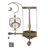 Unknown ? An Arts and Crafts wrought iron wall light with stylised floral scroll decoration,