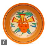 Clarice Cliff - Bobbins - A circular plate circa 1932, hand painted with stylised flowers, foliage