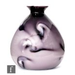 In the manner of Loetz - A vase of tapered ovoid form with flared collar neck, cased in tonal purple