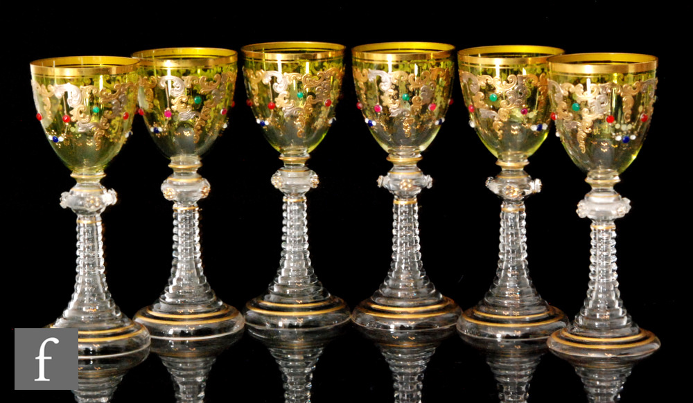 Moser - A set of six late 19th Century hock glasses, each with a green ovoid bowl heavily gilded