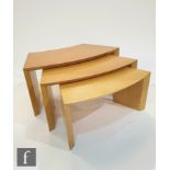 Ligne Roset ? A nest of three French maple tables of curved form, label to side, largest 80cm x