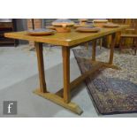 Cotswold School - An oak refectory style table, the later associated one piece top above six