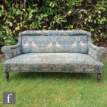 In the manner of Howard & Sons for Morris & Co - A bench seat or sofa on ring turned and tapered