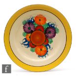 Clarice Cliff - Gay Day - A large circular plate circa 1930, radially hand painted with stylised