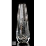 Kosta - A post war clear crystal vase of tapering sleeve form with slice cut panels, engraved