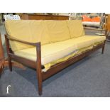 In the manner of Toothill for Heals - A teak framed three-seat sofa or settee, with an open frame,
