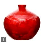 Bernard Moore - An early 20th Century Flambe vase of compressed form decorated with stylised cloud