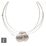 Unknown - Three silver tubular necklets each terminating in a matt finished disc with raised
