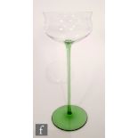 Otto Prutscher - Meyr's Neffe - An early 20th Century wine glass with a green circular spread foot