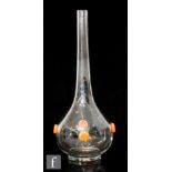 Daum - A 1920s clear glass vase of bottle form, decorated with four applied orange roundels,