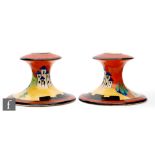 Clarice Cliff -Applique Lucerne - A pair of shape 310 candle sticks circa 1929, hand painted with an