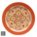 Clarice Cliff - Brown Persian - A ribbed circular plate circa 1937, hand painted with a variant of