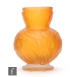 Daum - An early 20th Century cameo glass vase of footed ovoid form with stepped collar neck, cased
