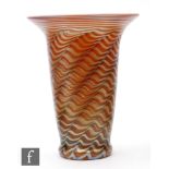 Lundberg Studios - A later 20th Century studio glass vase of footed tumbler form with flared rim,