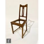 In the manner of Liberty & Co – An Arts and Crafts oak side chair