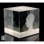 Nancy Sutcliffe - A polished glass cube hand engraved to one face with a head in profile wearing a