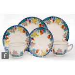 Clarice Cliff - Chloris - A pair of tea cups and saucers transfer printed with a band of flowers and