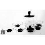 Simon Gate - Orrefors - A collection of 1930s glass dishes, all clear with an applied black foot,