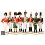 Clarice Cliff - The Old Brigade - A complete set of eight figures modelled as Military figures circa