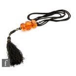 Liberty - An Art Deco necklace with three large faceted amber beads on a black silk cord terminating