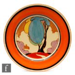 Clarice Cliff - Blue Autumn - A circular plate circa 1931, hand painted with a stylised tree and
