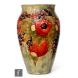 William Moorcroft - A large Pomegranate pattern vase decorated with whole and open fruit amidst