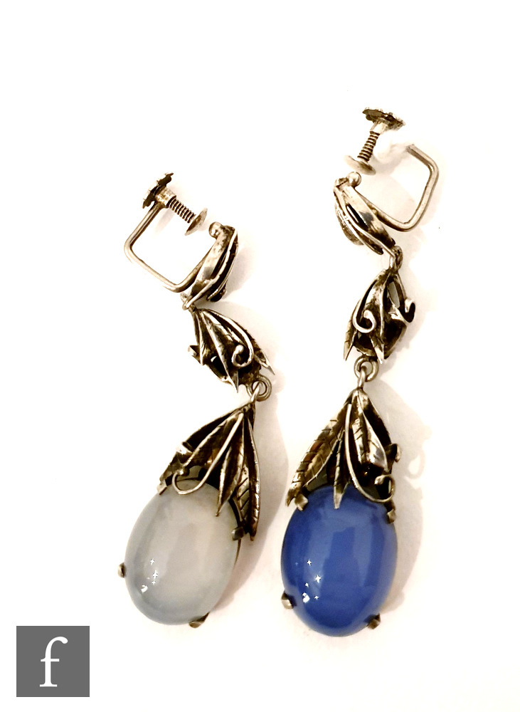 Bernard Instone - A pair of pendant drop earrings, each with stylised foliage above a cabochon cut