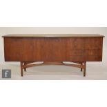 Dalescraft Furniture - A teak sideboard, the rounded rectangular top above a fall-front drinks