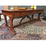 In the manner of A.W.N Pugin - A pitch pine library table, the rectangular top with a thumb-